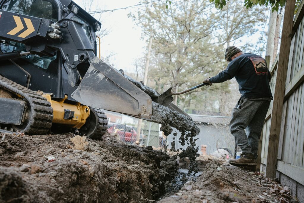 Construction crew pouring a solid concrete foundation for a new custom home in the DFW area.